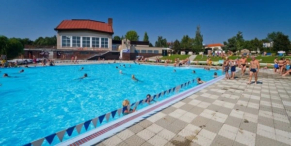 Outdoor swimming pool with people