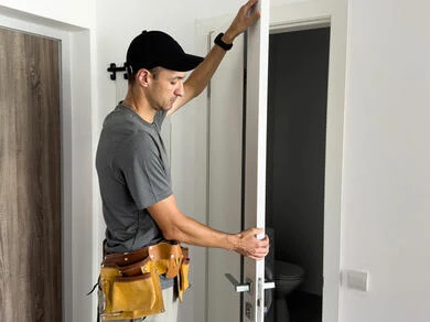 Man repairing door frame