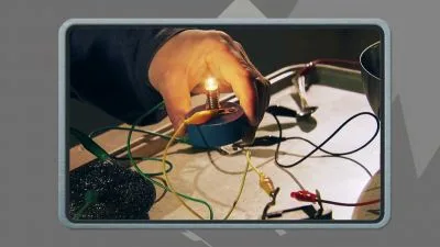 Ruka drží žárovku v elektrickém obvodu s vodiči.