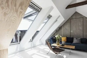 Attic room with skylight and balcony access