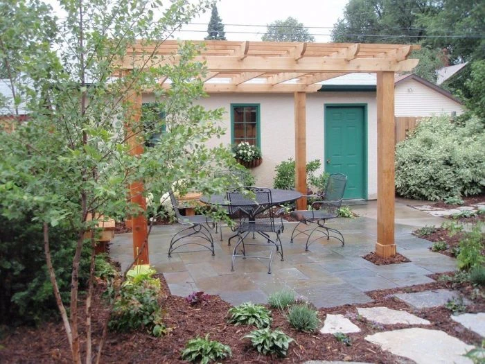 Wooden pergola with patio furniture