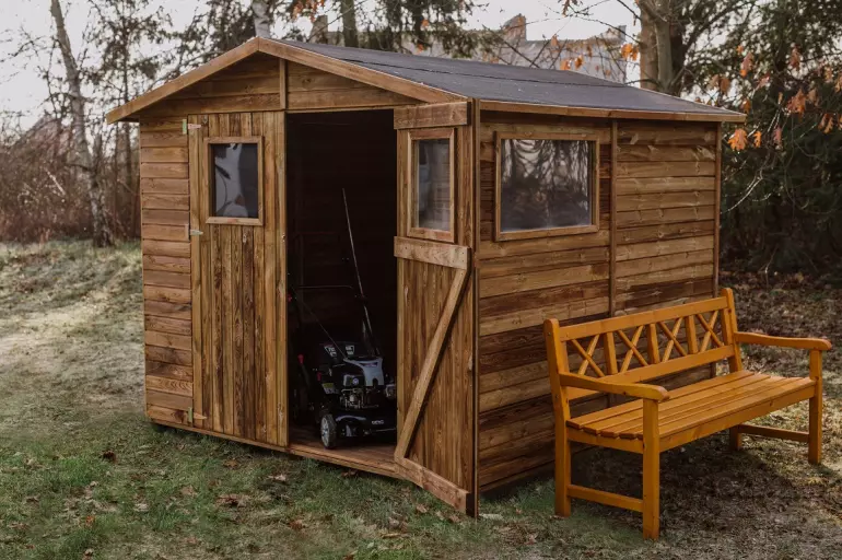Wooden garden shed with bench