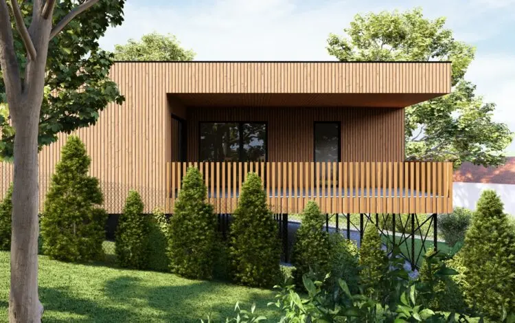Moderní dřevěný dům na klíč v zeleném prostředí.